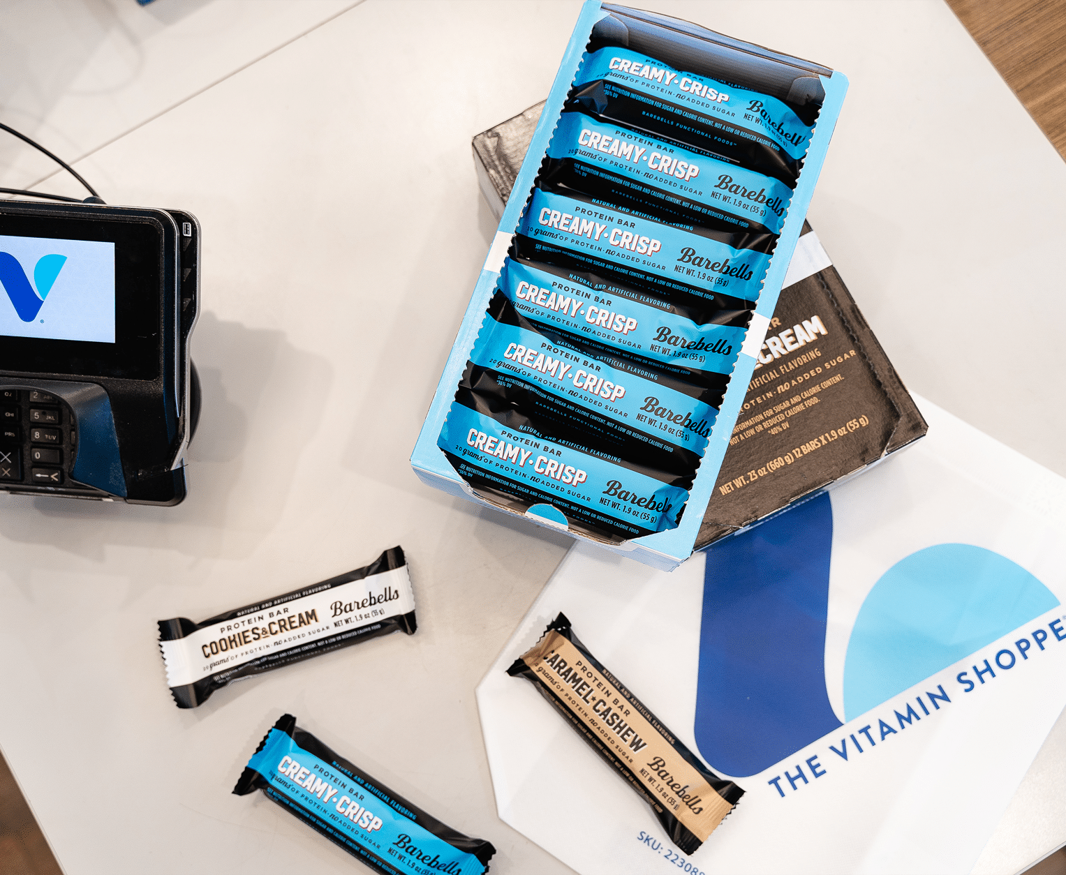 Protein bars on checkout counter at The Vitamin Shoppe store.